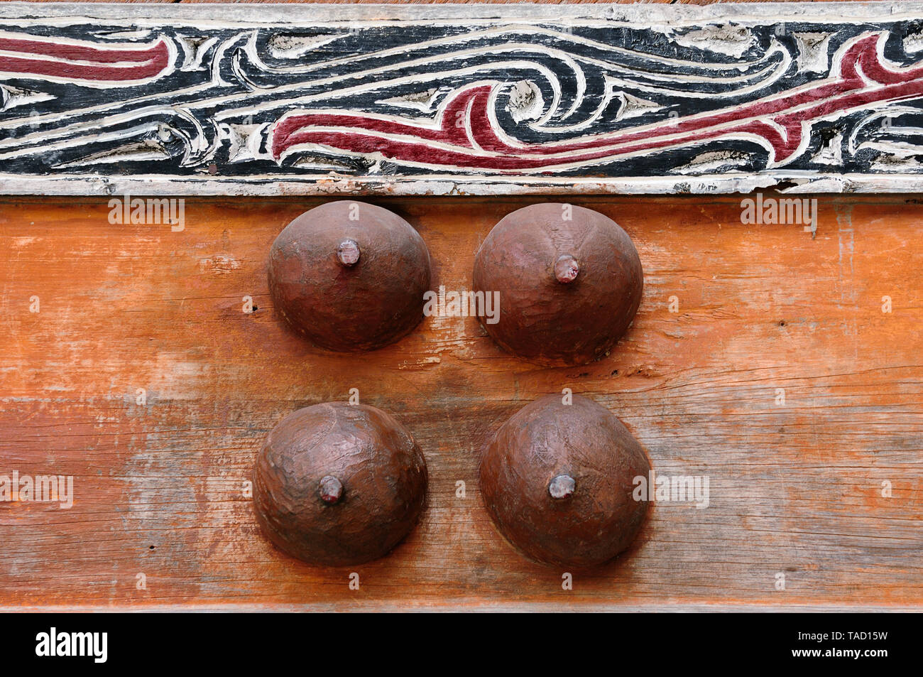 Batak carving on the wall of the village in the area of the Toba lake. Samosir Island, Indonesia Stock Photo