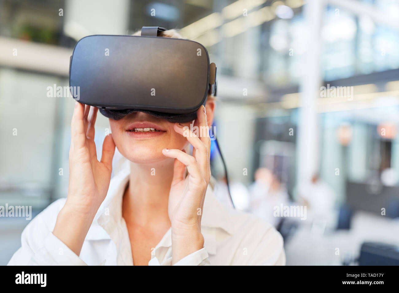 Female doctor is learning medicine diagnostics in a simulation with a virtual reality glasses Stock Photo