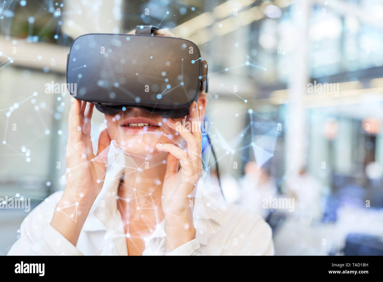 Female doctor with virtual reality glasses in front of digital network connection Stock Photo