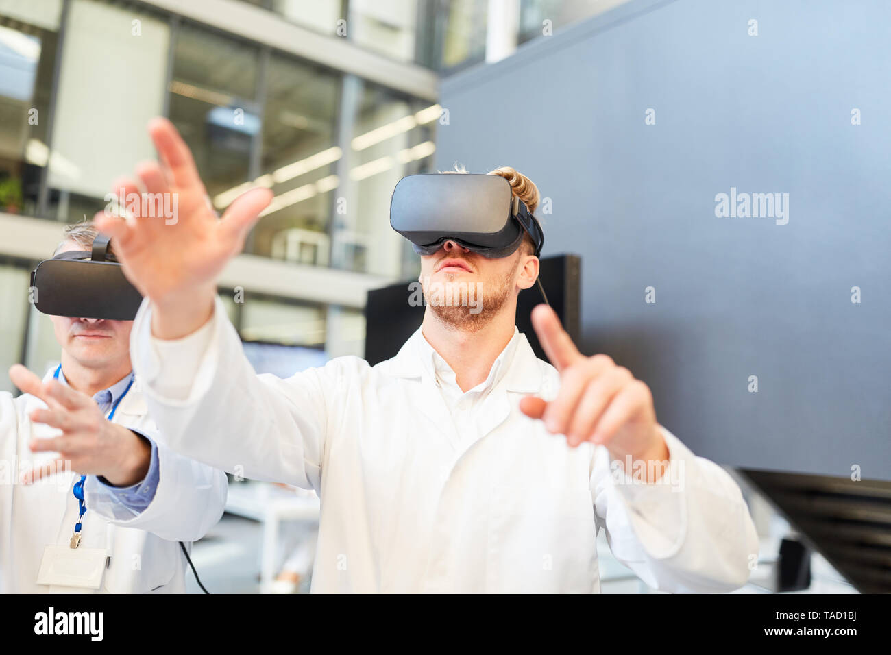 Two doctors in the 3D simulation with a virtual reality glasses as an innovation Stock Photo