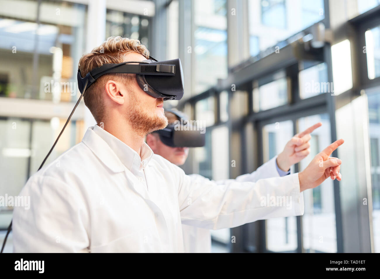 Researchers train with VR glasses for medicine in simulated 3D reality Stock Photo
