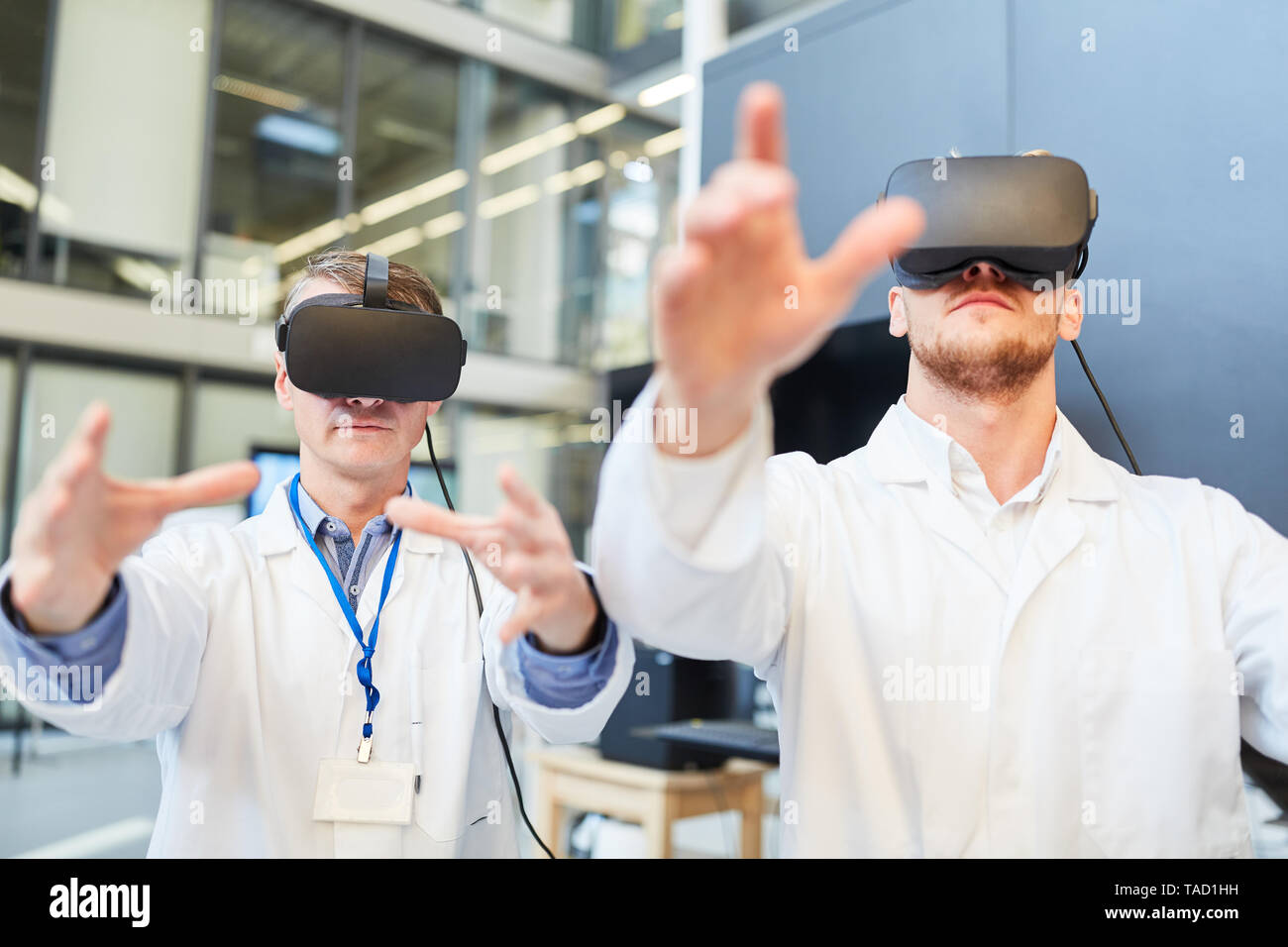 Doctors train in a 3D simulation with VR glasses for medicine diagnostics Stock Photo