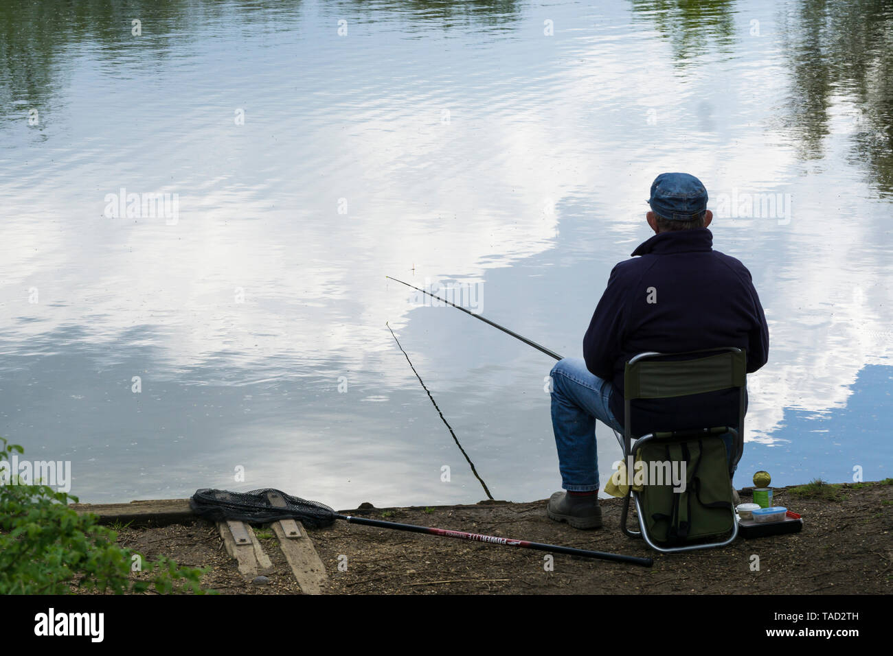 Cloud fisherman at lakeside Milton park Cambridge 2019 Stock Photo