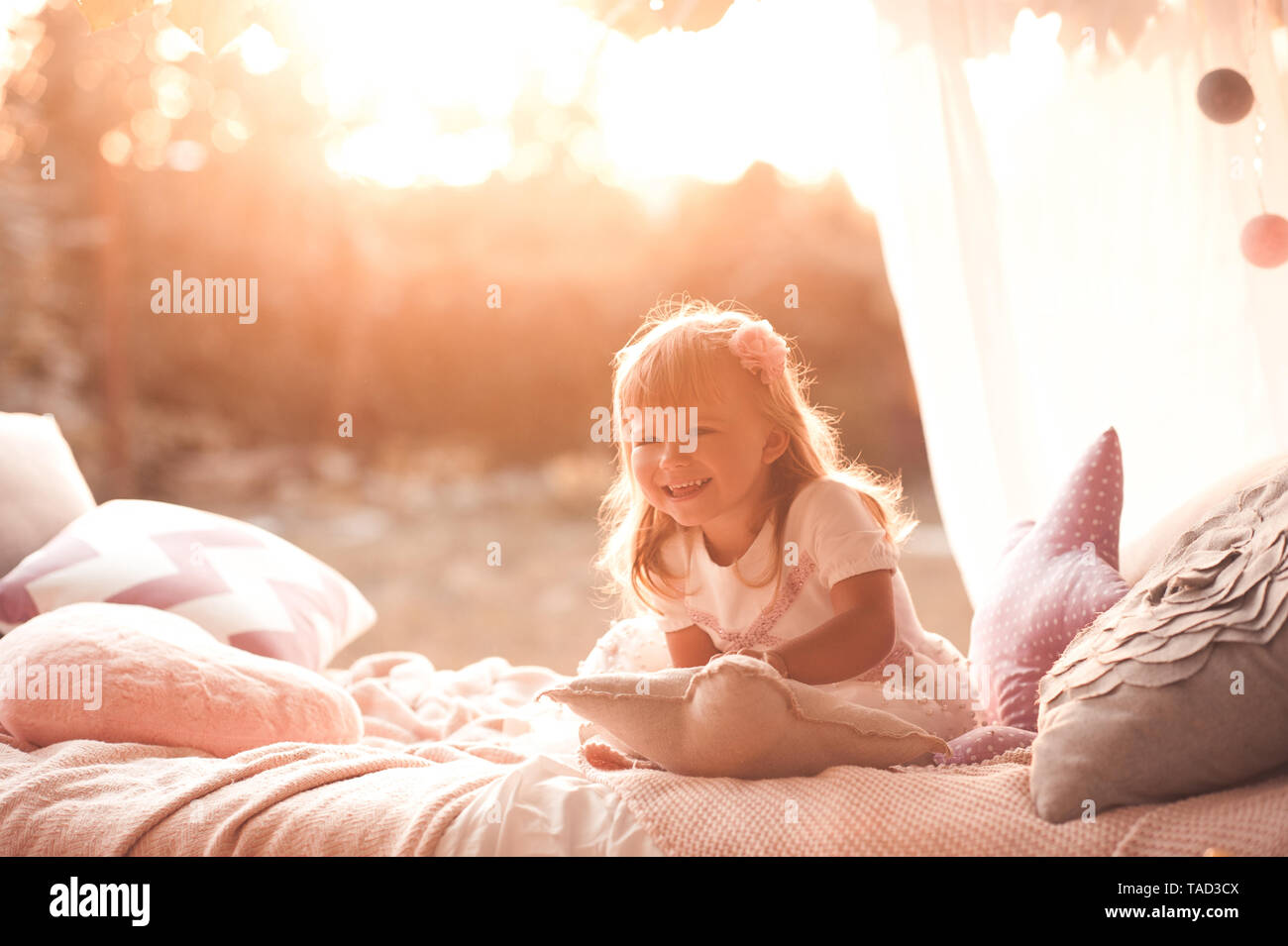 Happy child girl 12 year old wake up in bed. Good morning Stock Photo