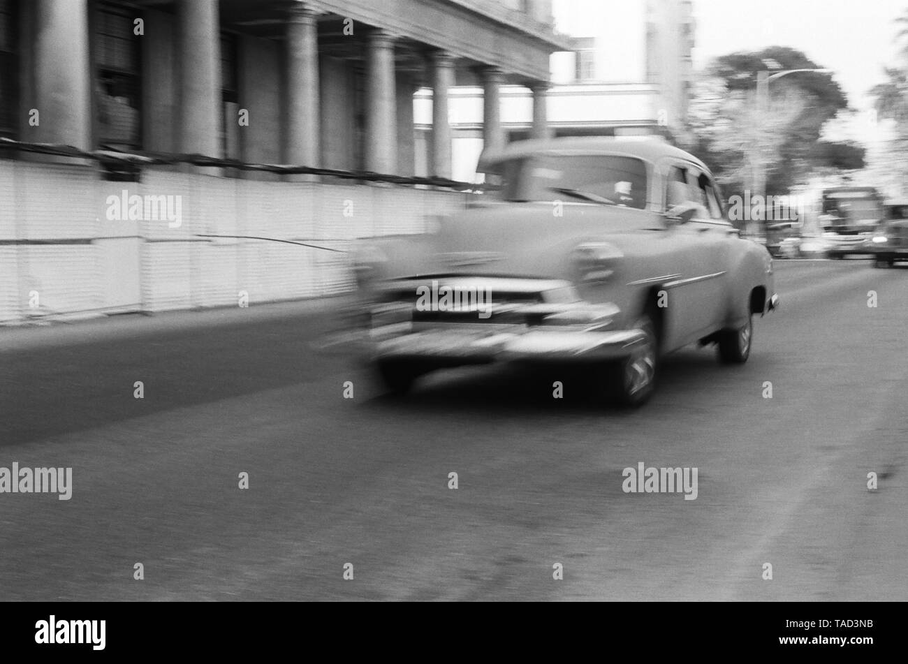 An American car speeds through the city of Havana Cuba Stock Photo