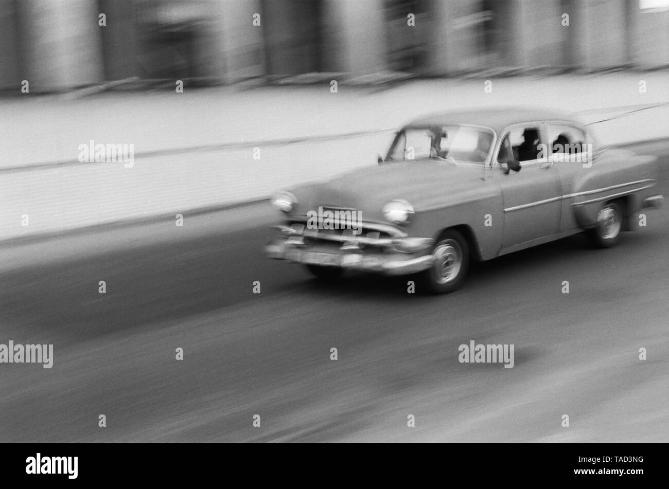 An American car speeds through the city of Havana Cuba Stock Photo