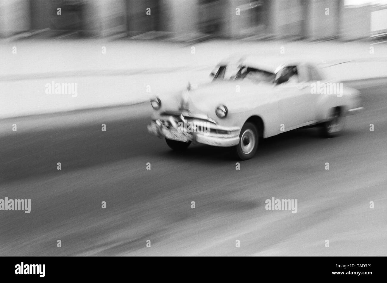 An American car speeds through the city of Havana Cuba Stock Photo