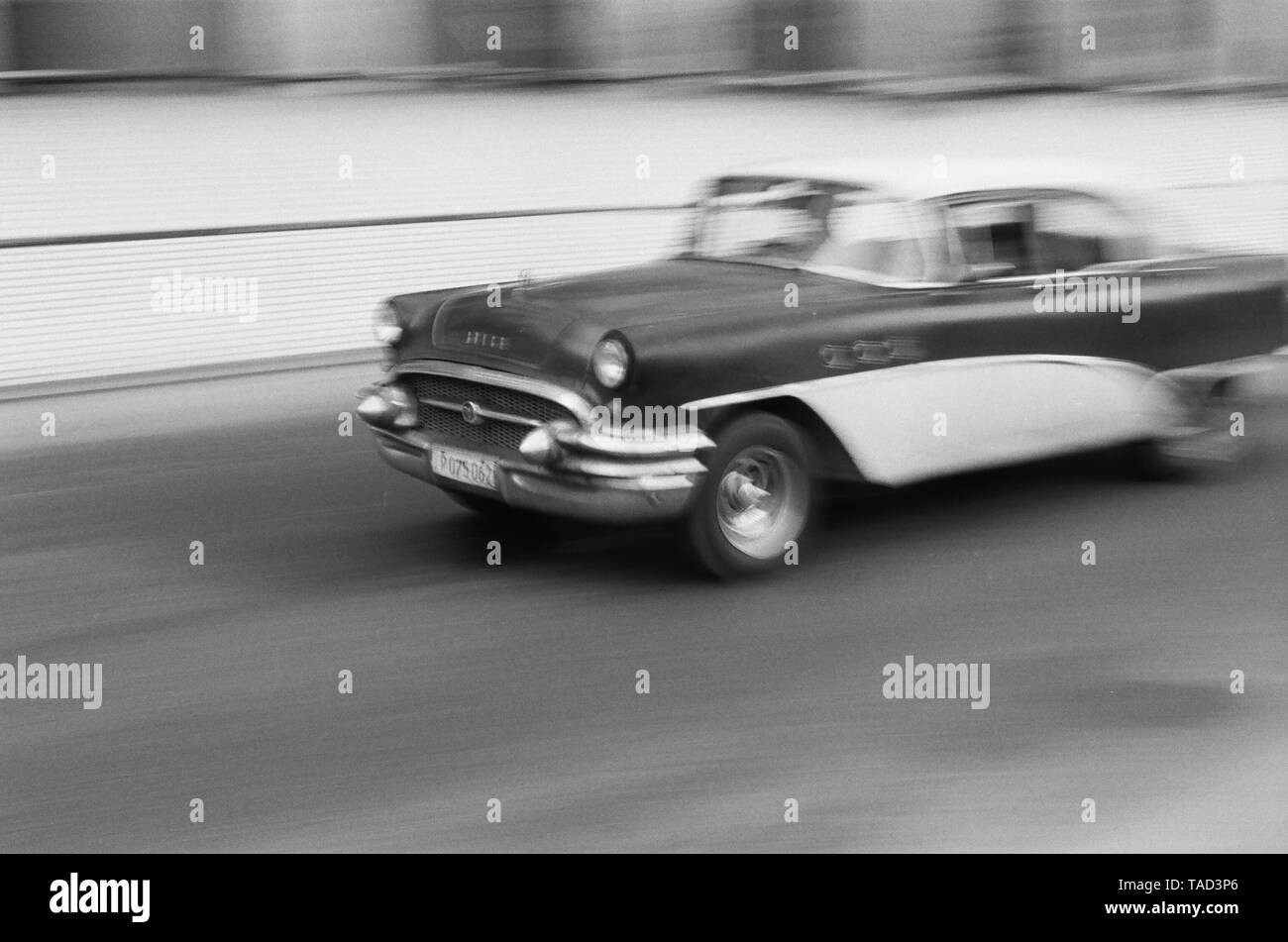 An American car speeds through the city of Havana Cuba Stock Photo