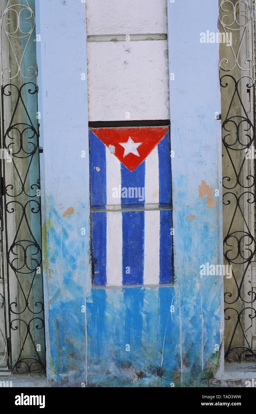 The Cuban flag is painted on the front door of a house in Havana Stock Photo
