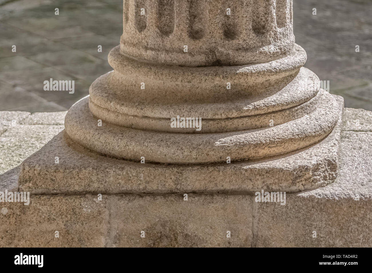 Detail view of a ionic style base column, romanesque columns gallery, Portugal Stock Photo