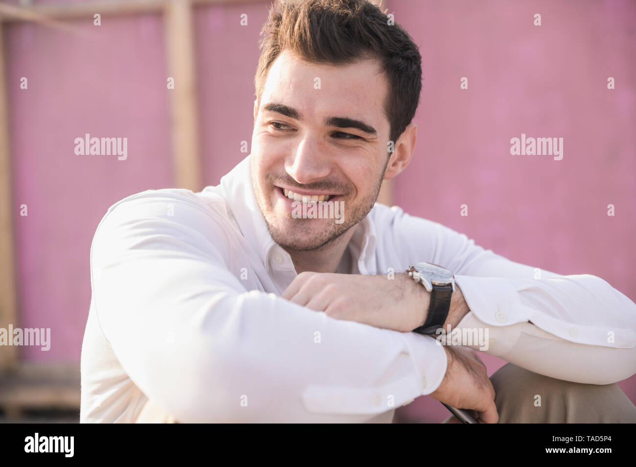 Smiling man in pink hi-res stock photography and images - Alamy