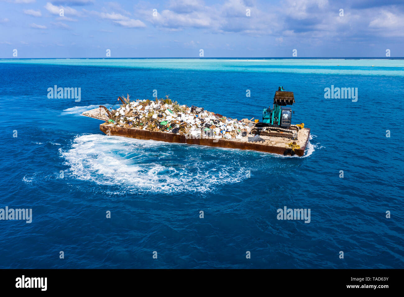 Maledives, South-Male-Atoll, plastic waste disposal with digger Stock Photo