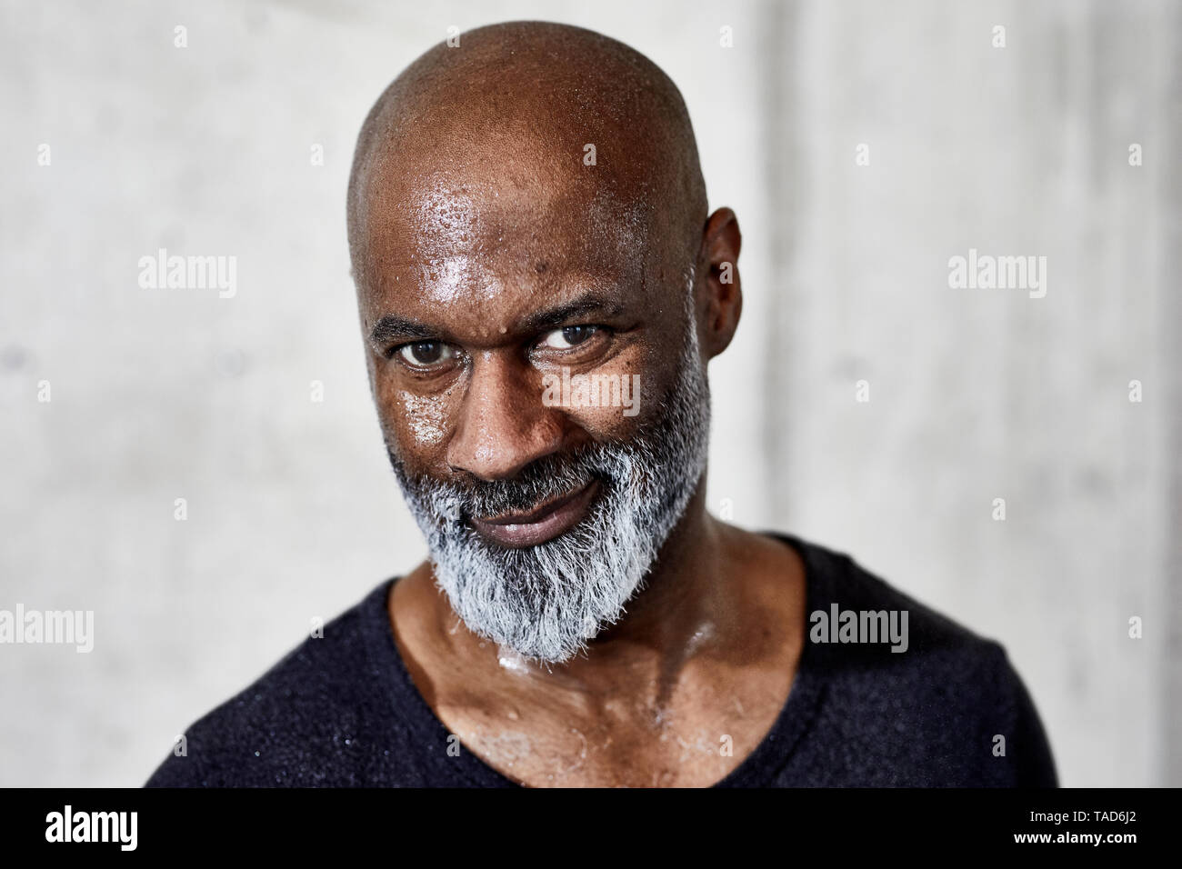 Portrait of smiling sweating mature man Stock Photo