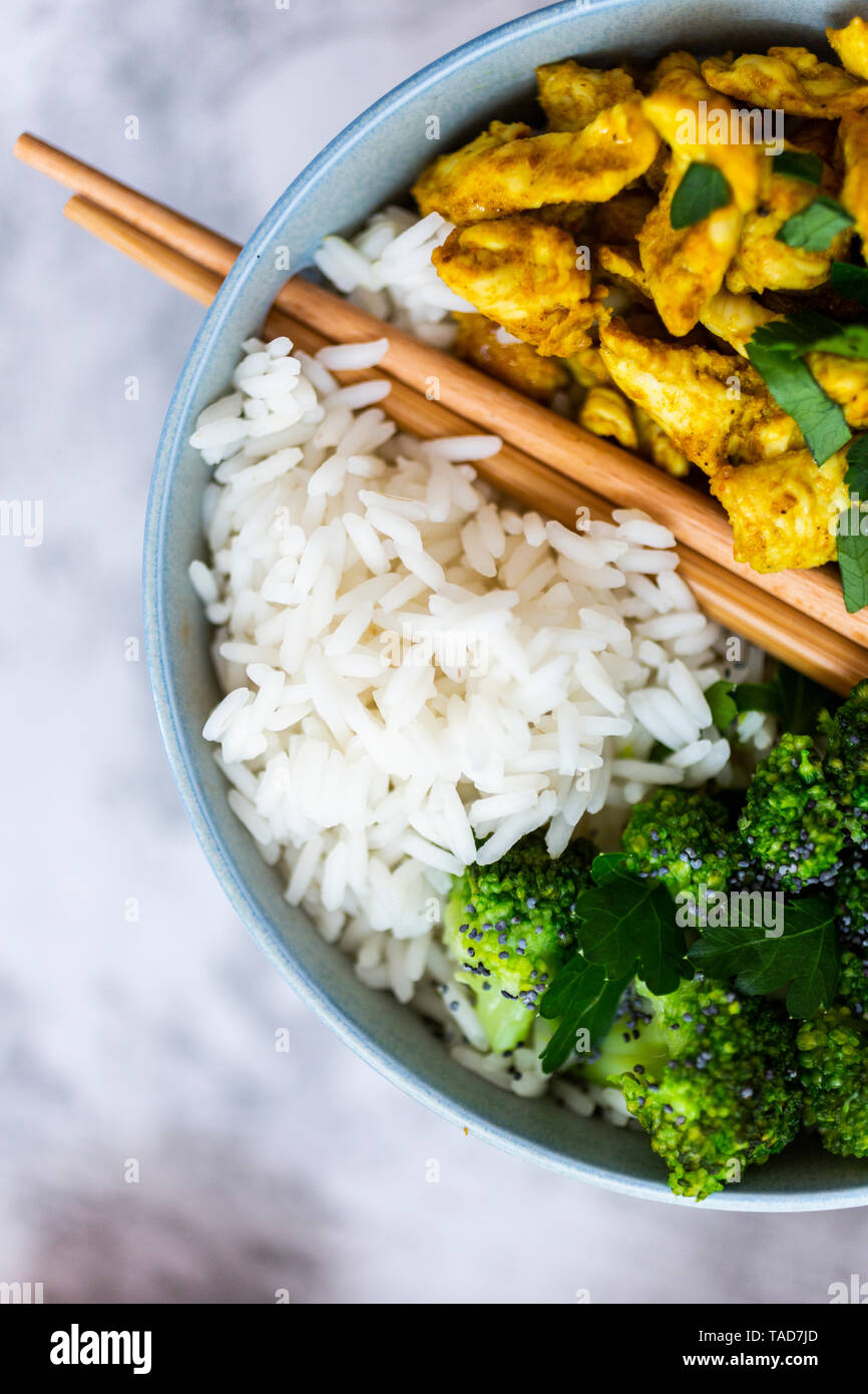 Rice with chicken curry and broccoli Stock Photo
