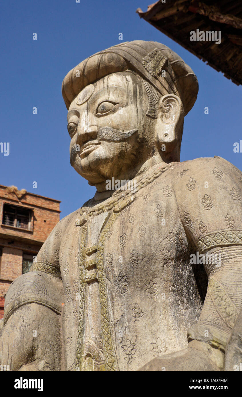 Carved stone temple guardian at the base of the steps up to the five-tiered Nyatapola pagoda temple in Taumadhi Tol, Bhaktapur, Kathmandu Valley, Nepa Stock Photo