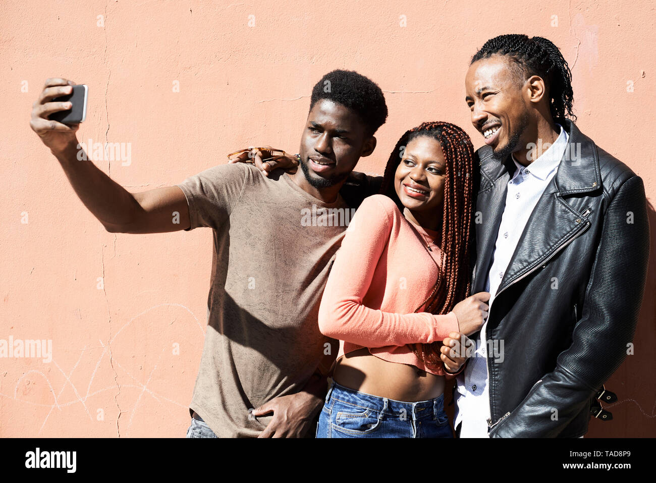 Three best friends taking selfie together outdoors Stock Photo - Alamy