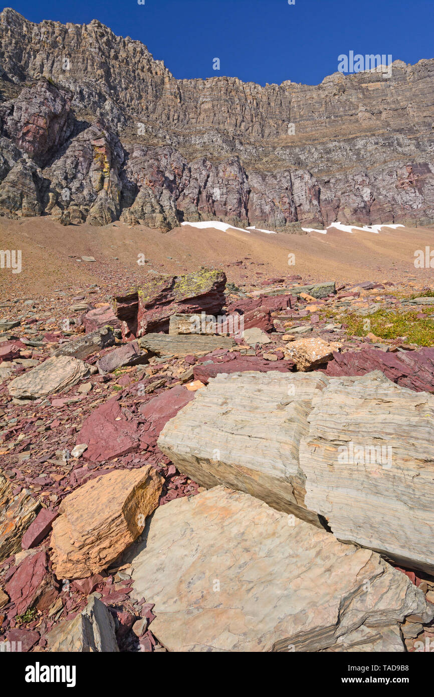Colorful Rocks Below a Mountain Ridge near Logan Pass in Glacier National Park in Montana Stock Photo