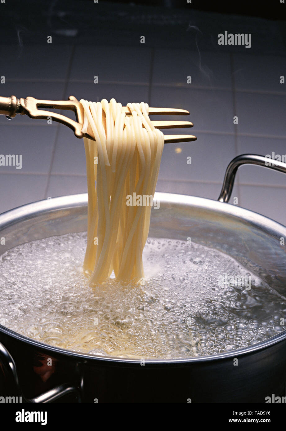 the process of cooking noodles Stock Photo Alamy