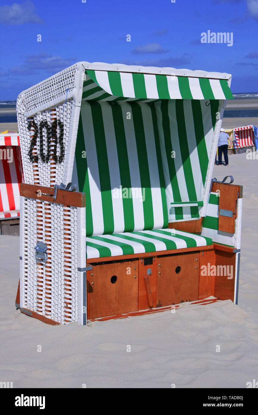 Roofed wicker beach chair at the 