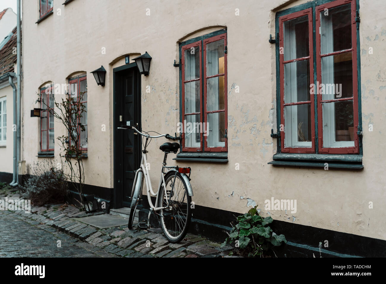 Denmark, Dragor, bicycle parked in front of residential house Stock Photo