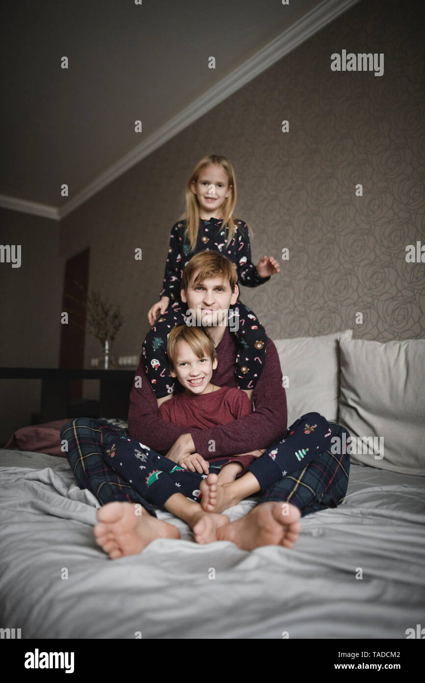 Family portrait of father and two children at home Stock Photo