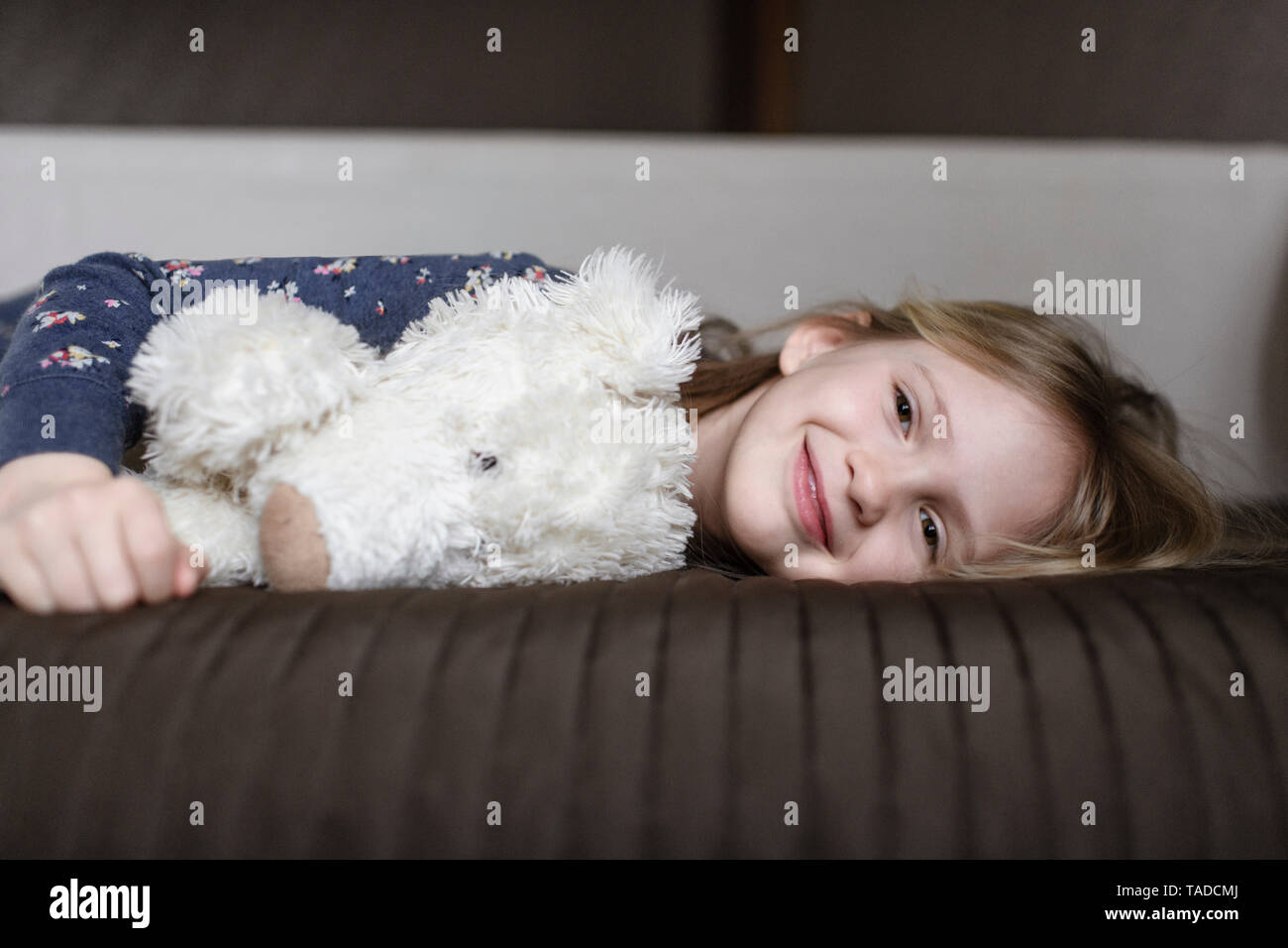 Portrait of happy little girl with white teddy bear Stock Photo - Alamy