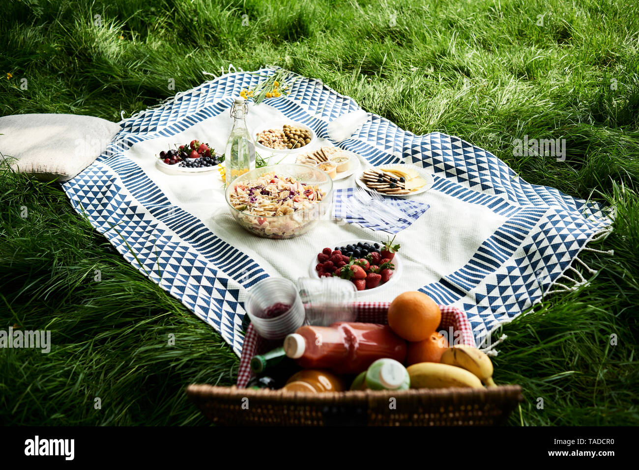 Healthy picnic snacks on a blanket in grass Stock Photo Alamy