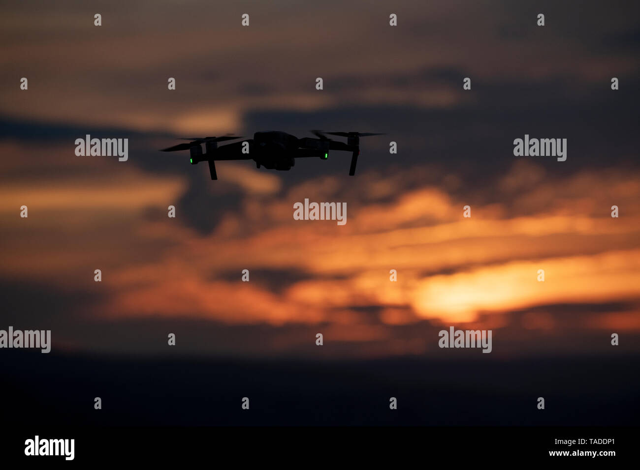 A drone flying above the Welsh countryside at sunset. Stock Photo