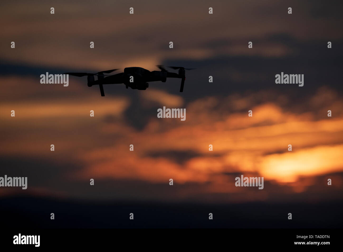 A drone flying above the Welsh countryside at sunset. Stock Photo