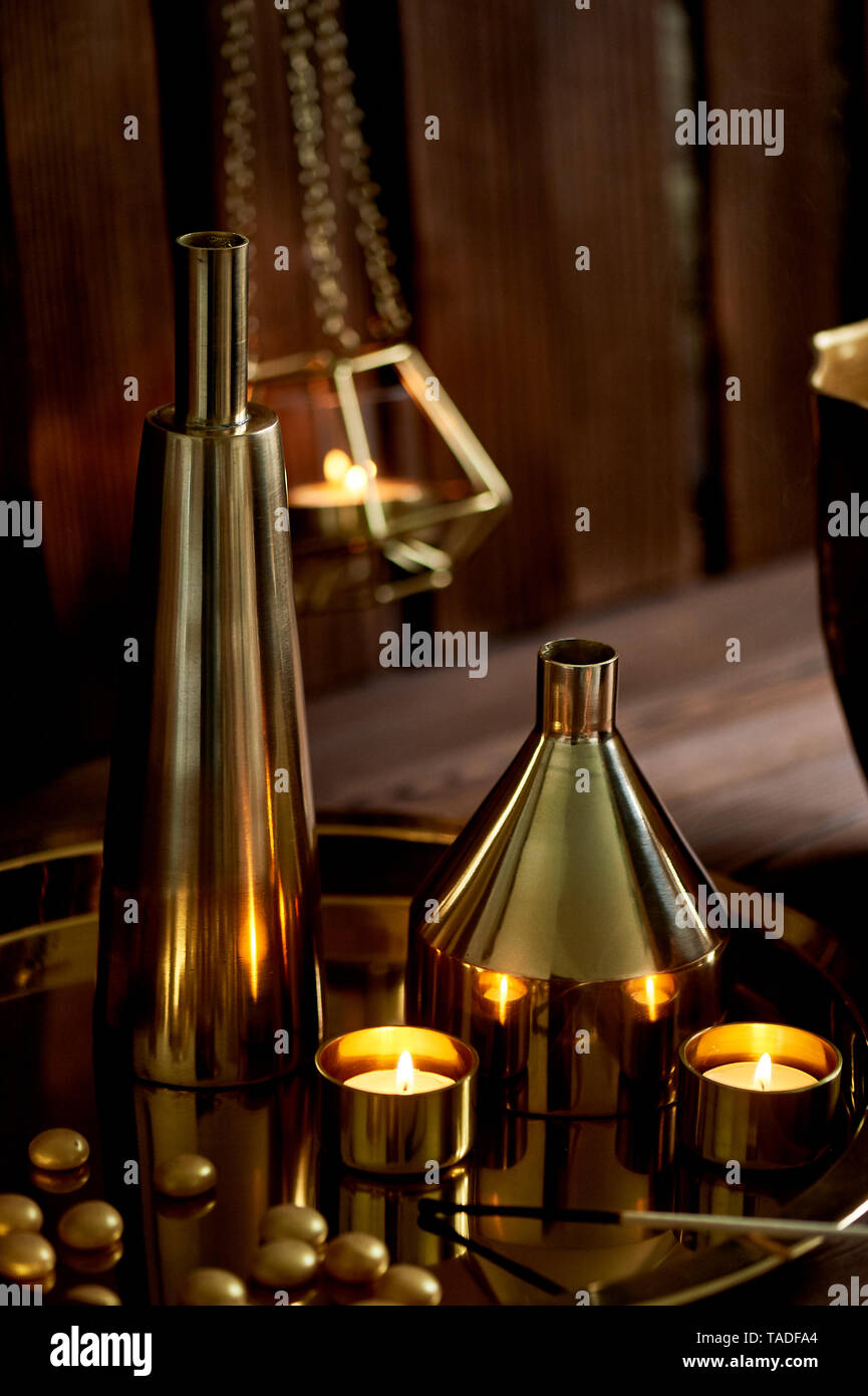 Cozy decor.Gold , burning candles, Golden vessels Stock Photo Alamy