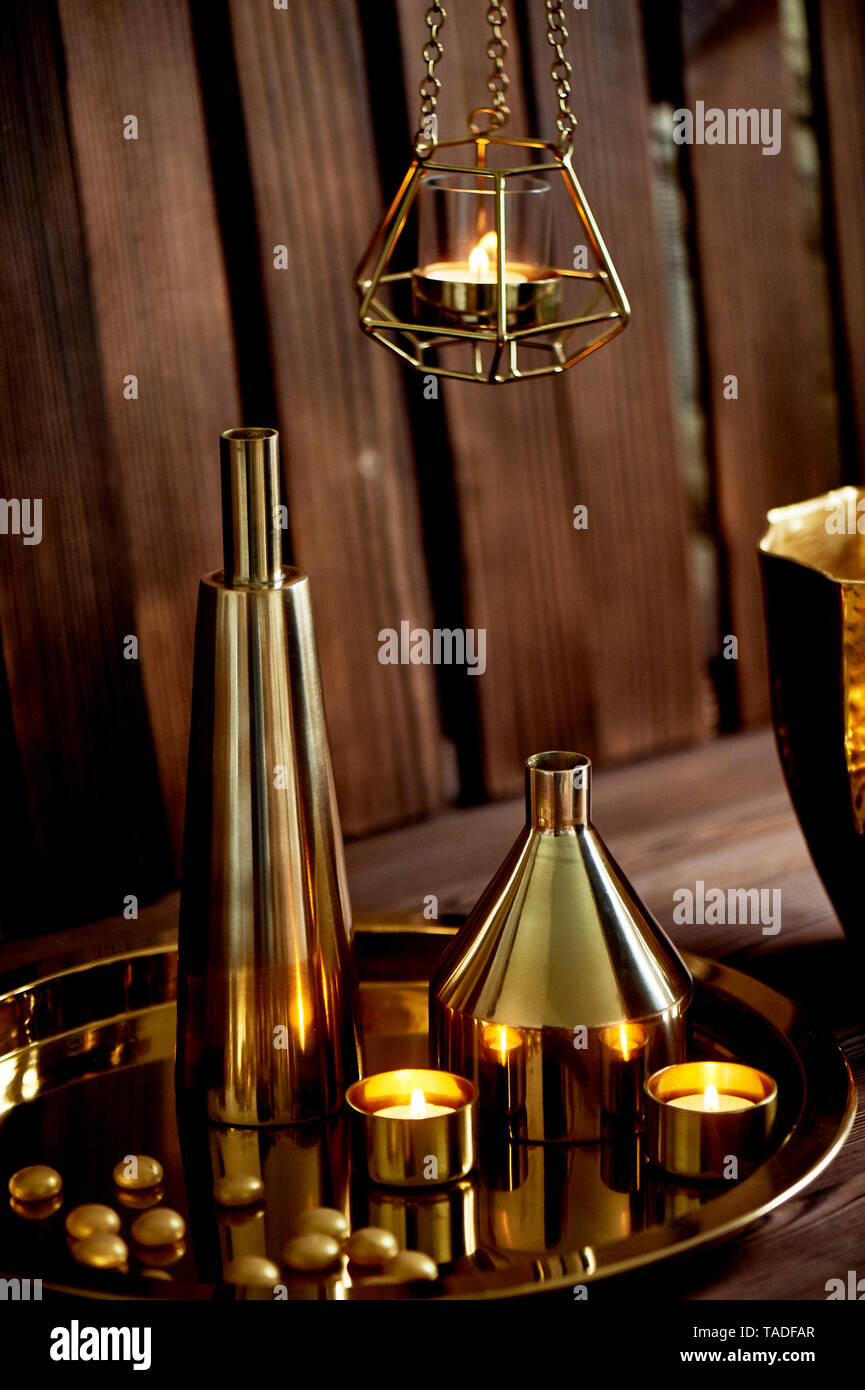 Cozy decor.Gold , burning candles, Golden vessels Stock Photo Alamy