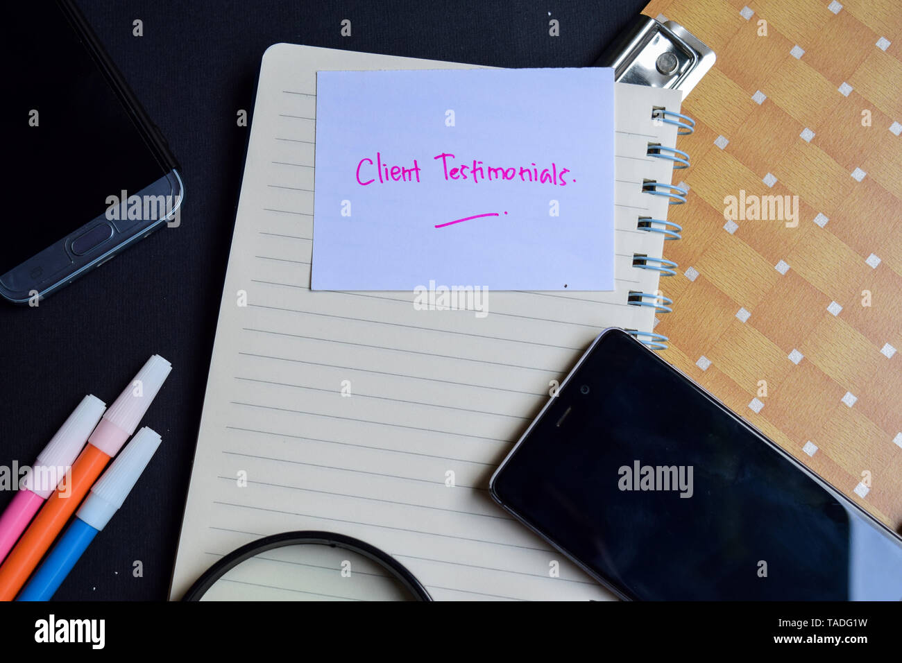 client testimonials written on paper isolated on black table Stock ...