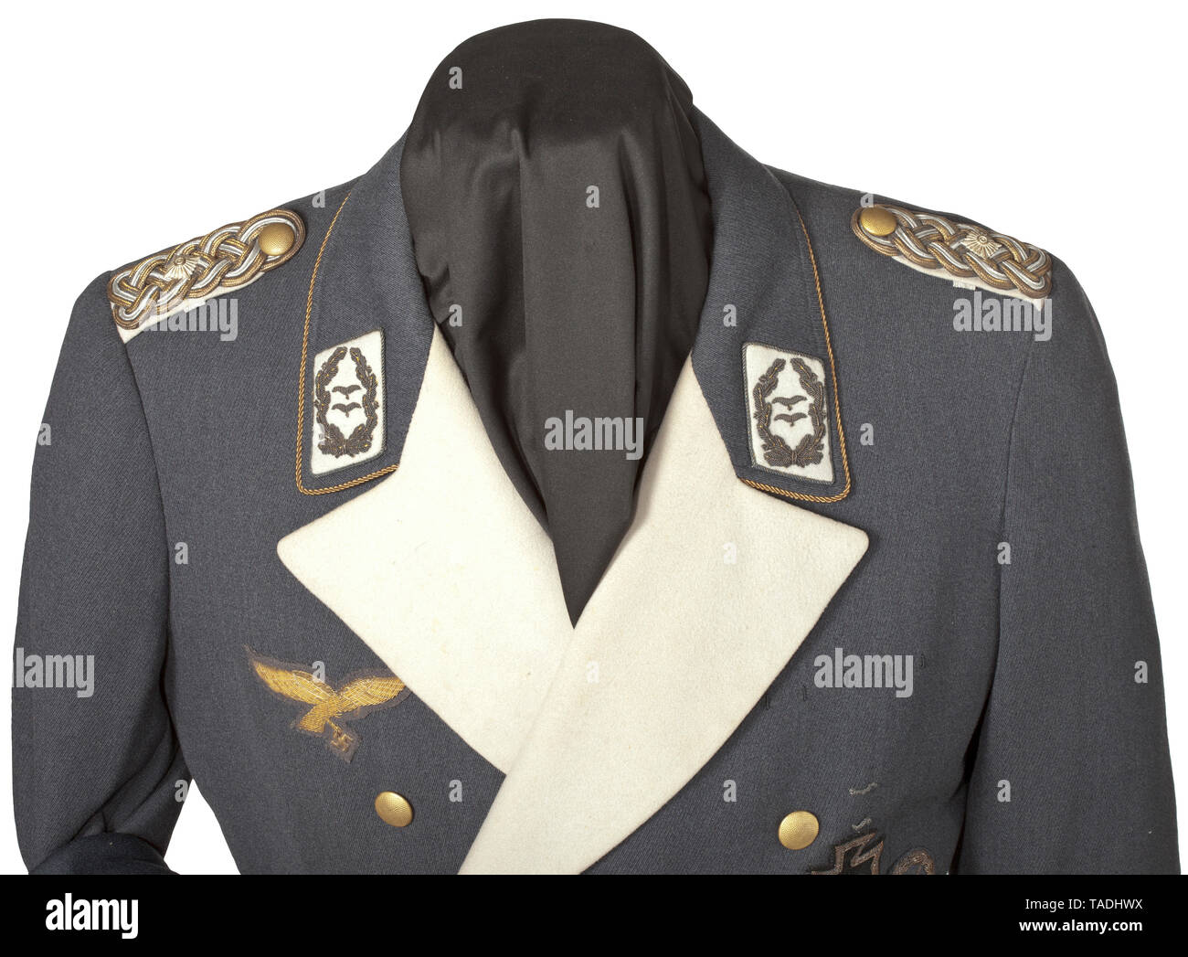 A dinner dress uniform of Generalleutnant a.D. Franz Müller-Michels made to measure by Averbeck & Bröskamp, Berlin Small tunic for general officers in Luftwaffe-blue gabardine with white-lined lapels and piping on the covered fly and cuffs, gold buttons, closed back vent. Blue silk liner with tailor label (worn out) and name tag in the inner pocket 'General Müller Januar 1936'. Gold-emb 20th century, Editorial-Use-Only Stock Photo