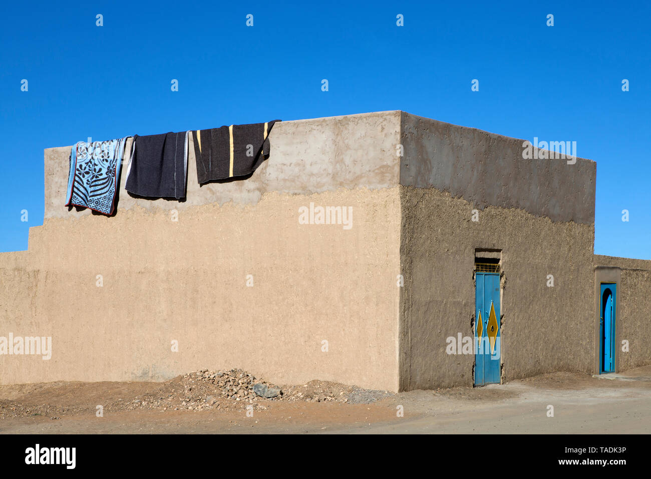 Morocco, Merzouga, Erg Chebbi, rammed earth building in oasis town Taouz Stock Photo
