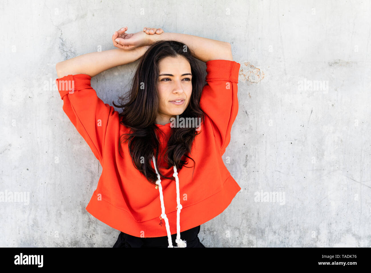 Young Contemporary Dancer Wearing Red Hoodie Shirt In Front Of A Wall Stock Photo Alamy