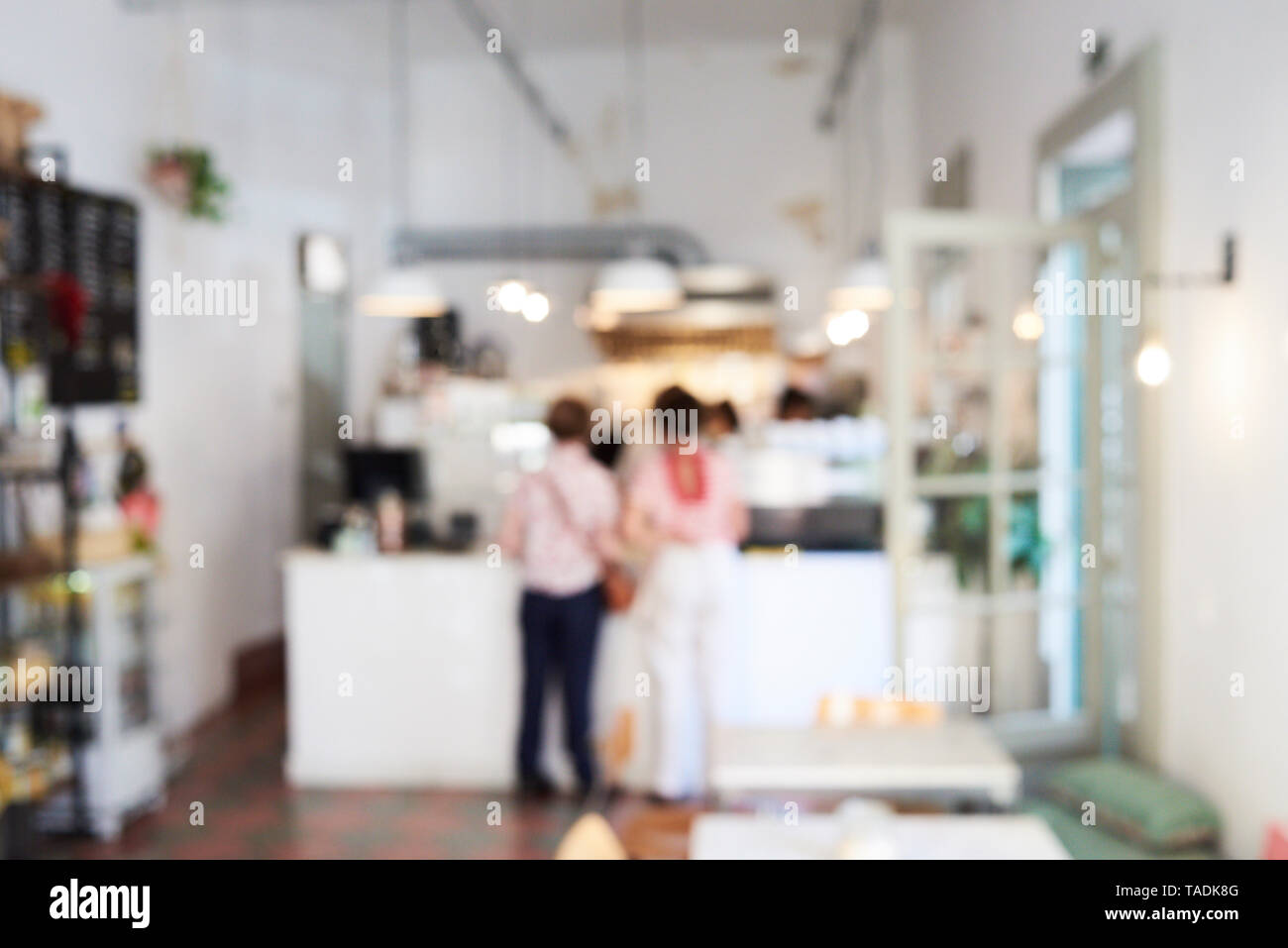Blurred view of people in a cafe Stock Photo