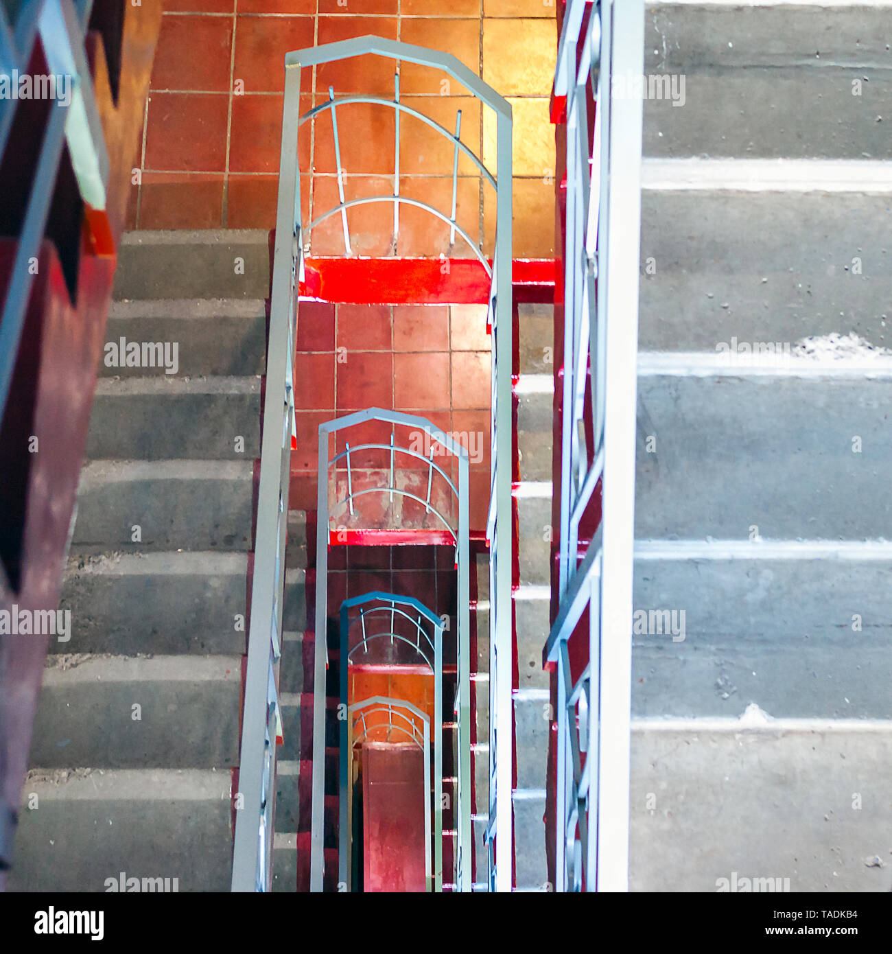 Top-Down View of Concrete Stairs, Metal Handrails in High-Rise Residential Building. Emergency Exit Concept. Stock Photo