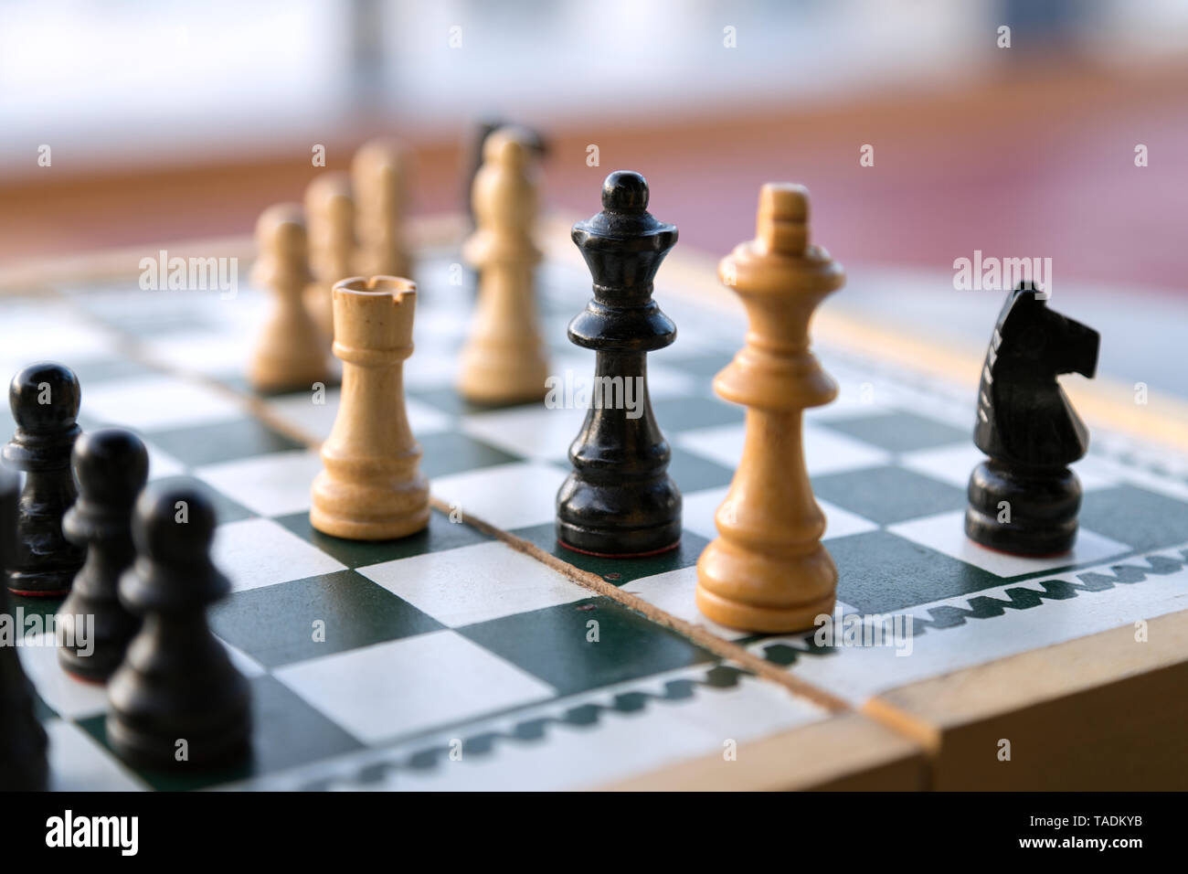 Wooden chess pieces on chessboard Stock Photo