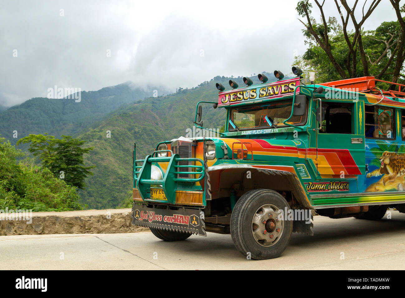 Baguio, Philippines - June 3, 2016: On a mountain road on a colorful jeepney Stock Photo
