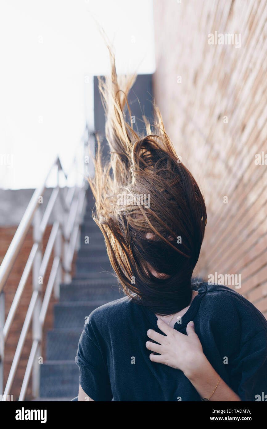 Spain, hair covering face of teenage girl Stock Photo