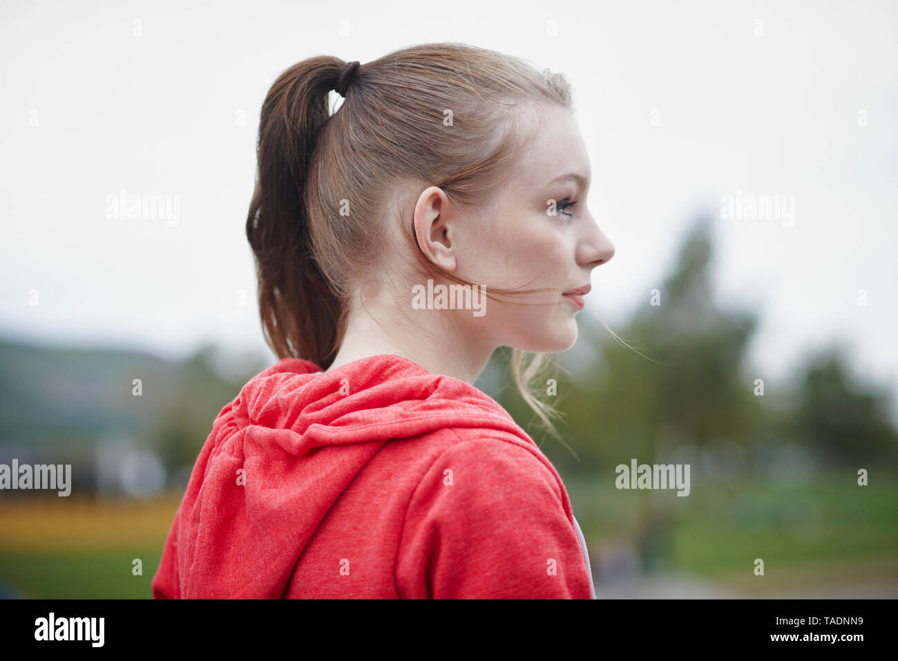 Profile of teenage girl with pigtail Stock Photo