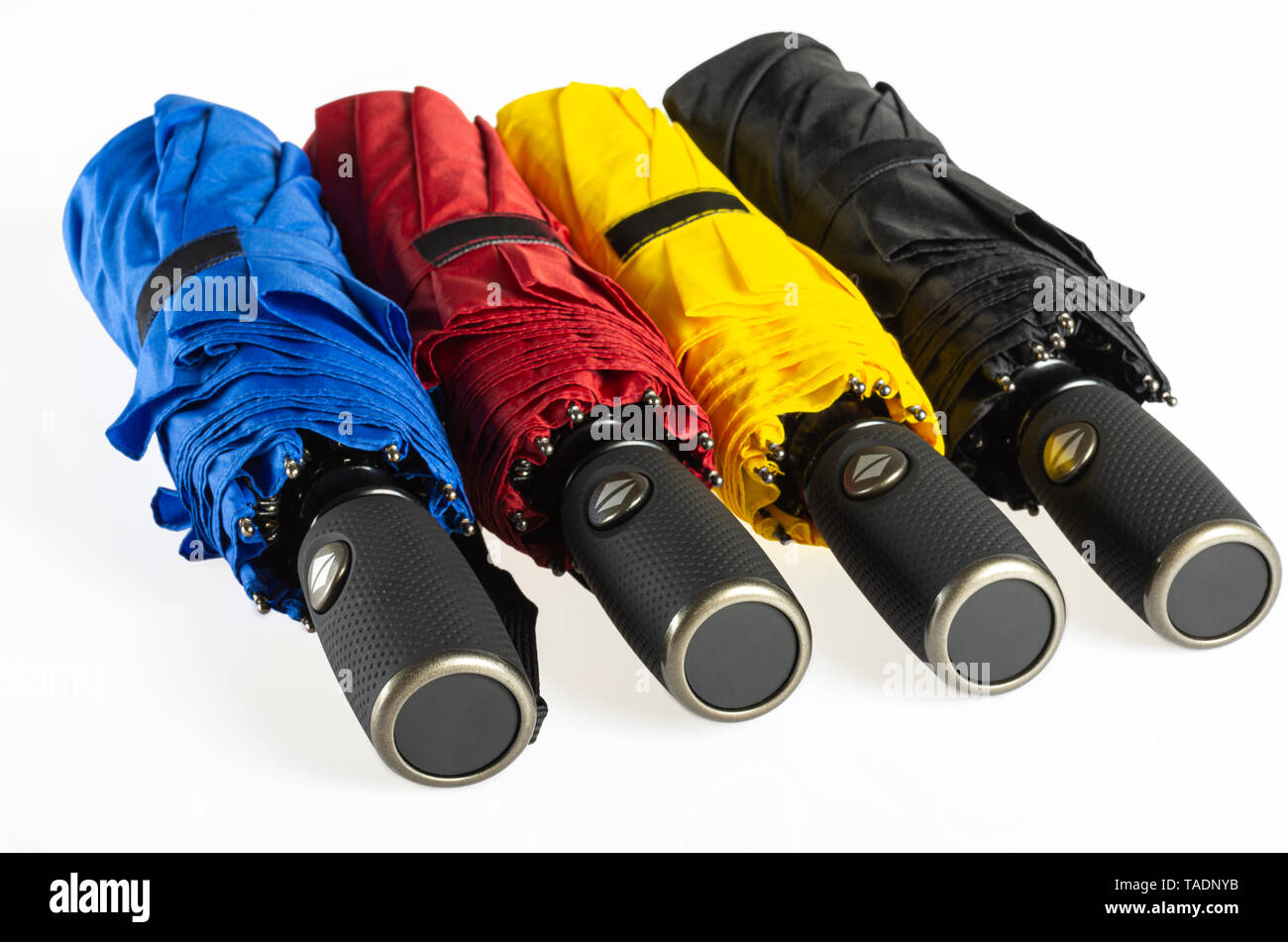 Multicolored folded umbrellas isolated on white Stock Photo