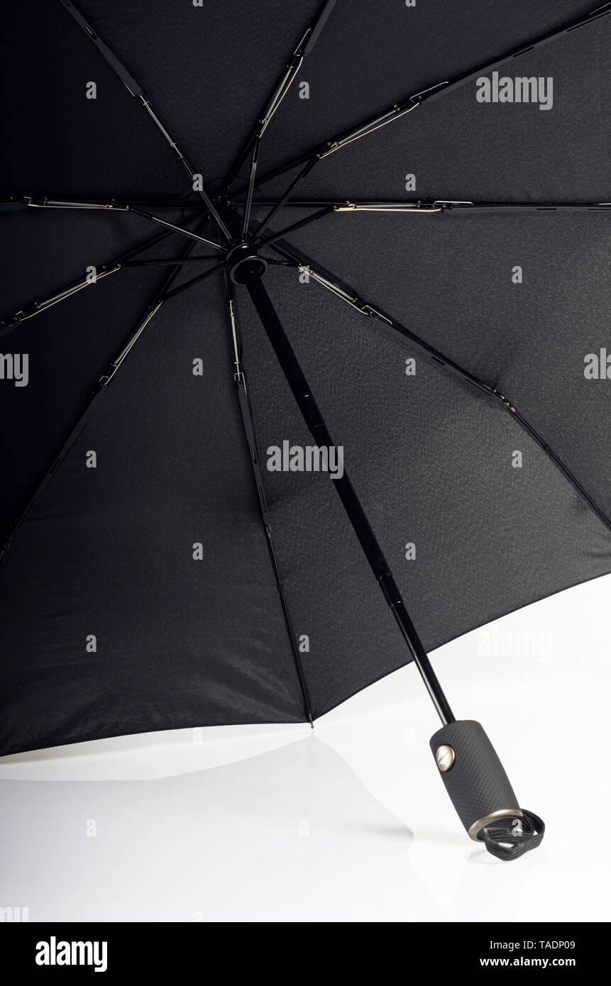 Open isolated black windproof umbrella with fiberglass ribs Stock Photo