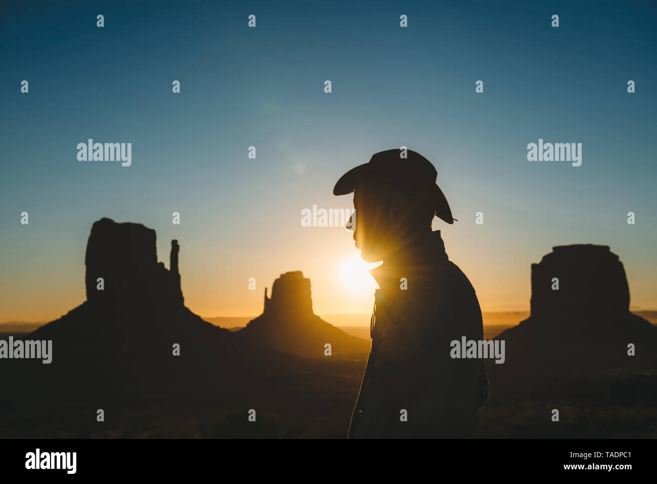 USA, Utah, Monument Valley, silhouette of man with cowboy hat at sunrise Stock Photo