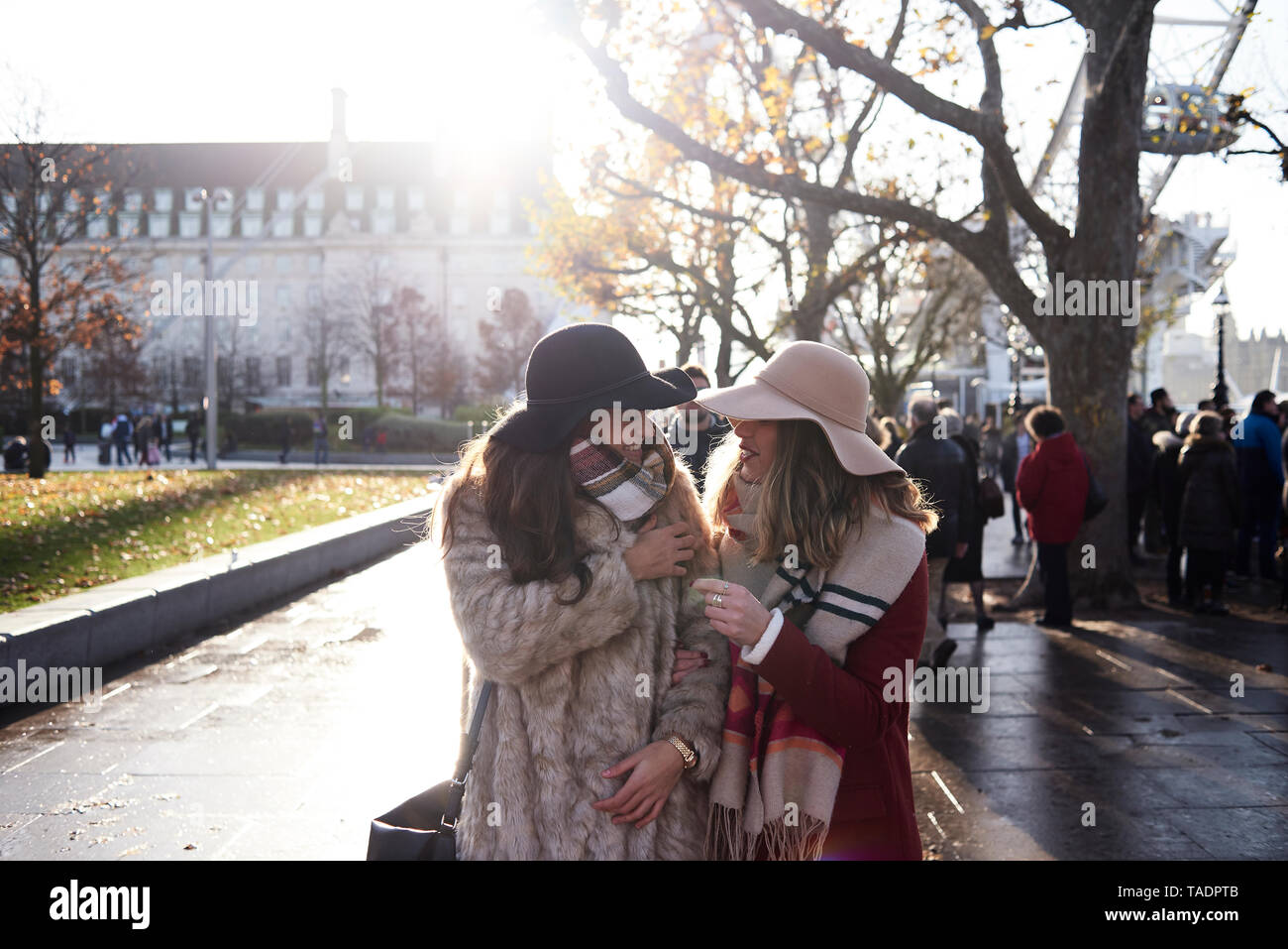 UK, London, two happy women in the city on the go Stock Photo