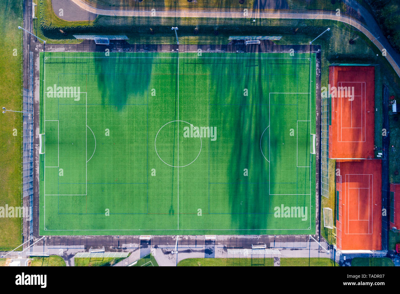 Empty football ground and tennis courts, top view Stock Photo