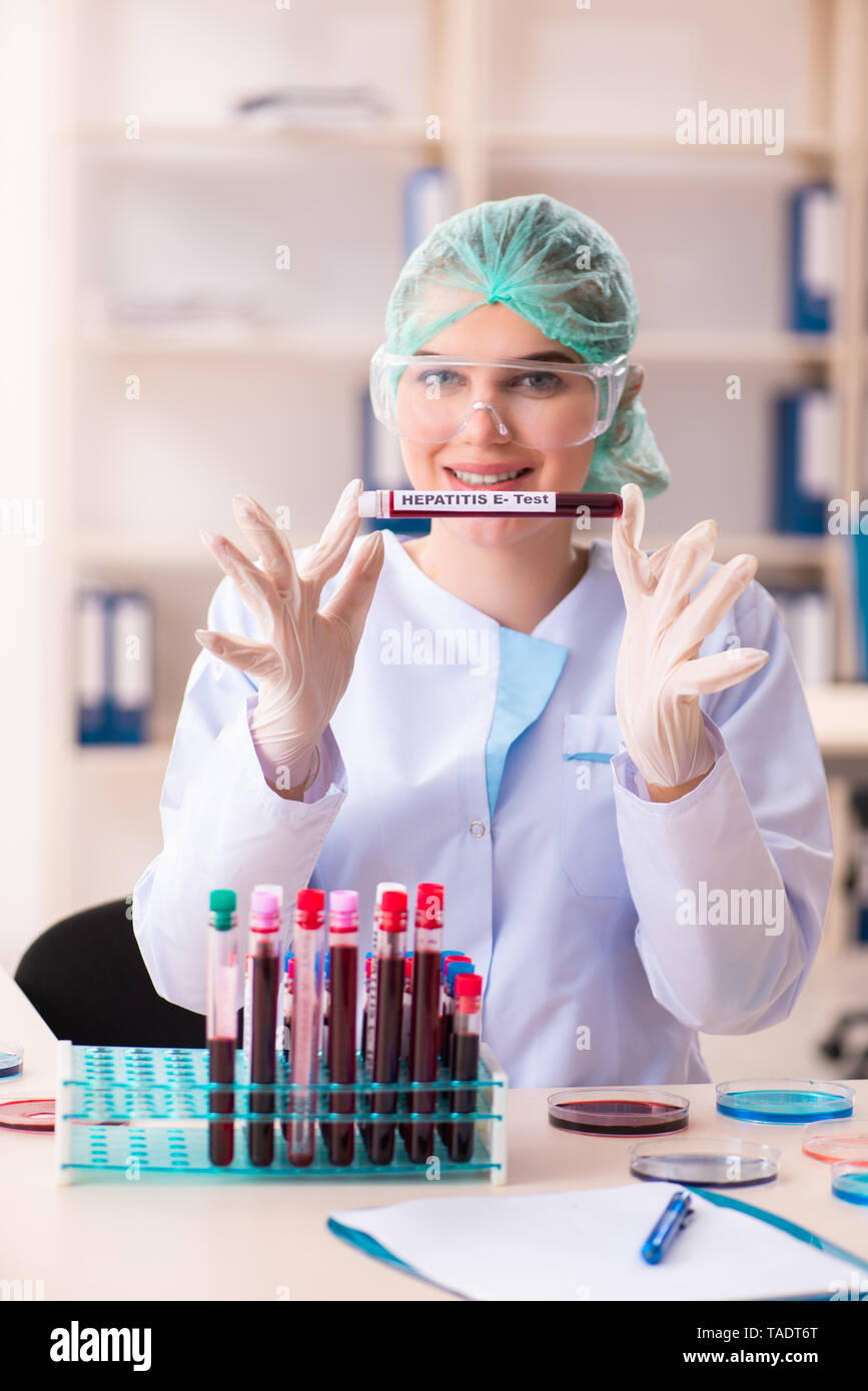 Female scientist presenting disease hi-res stock photography and images ...