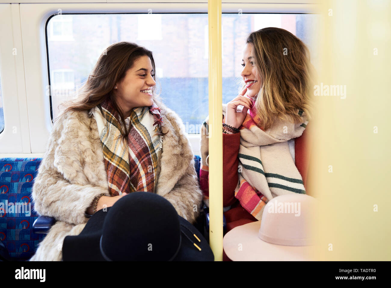 UK, London, two happy women in underground train Stock Photo