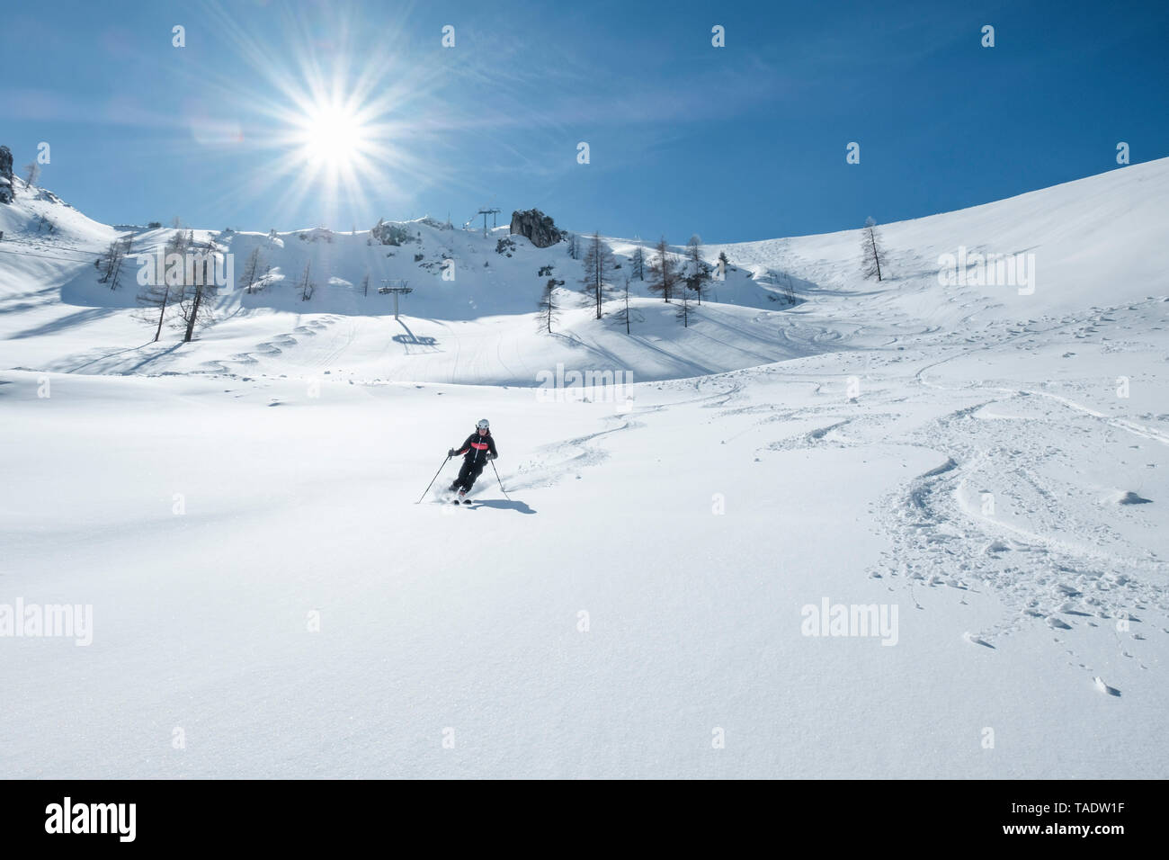 Germany, Bavaria, Berchtesgaden, Backcountry skiing against the sun Stock Photo