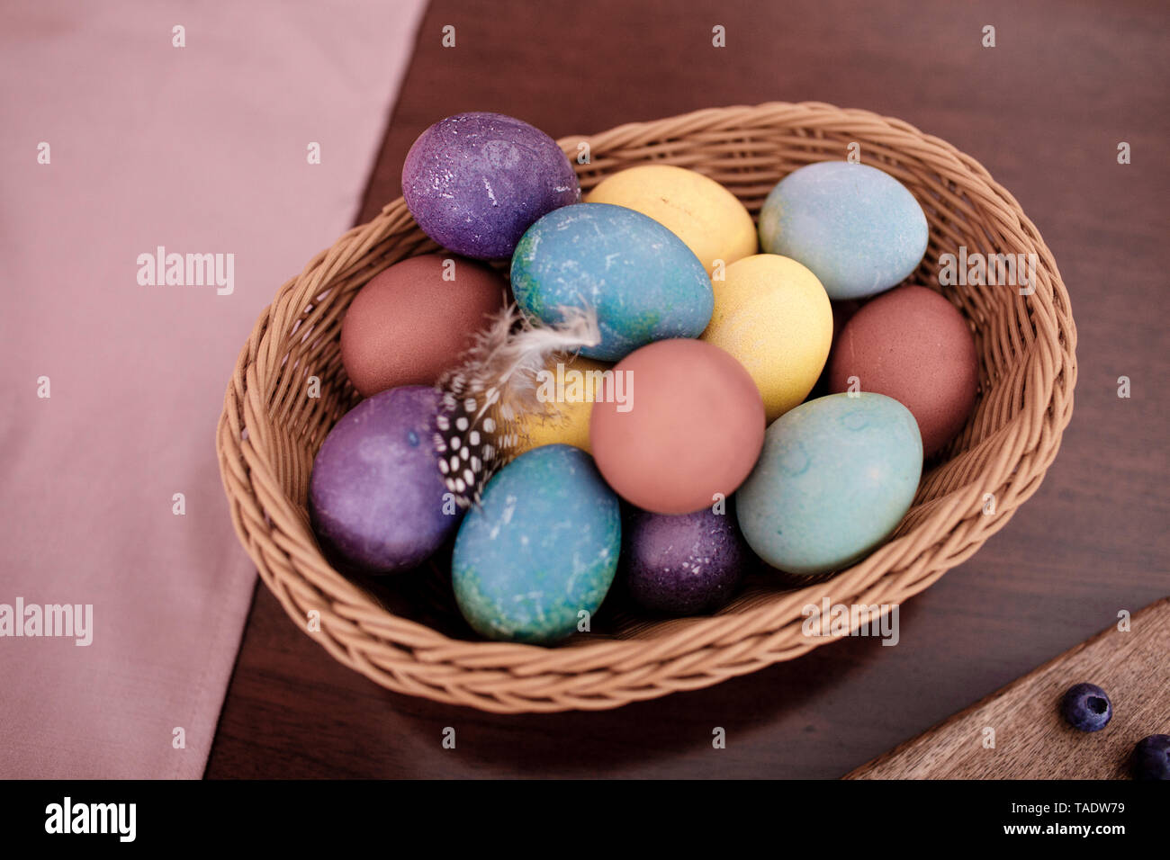 Dyed Easter eggs in a basket Stock Photo